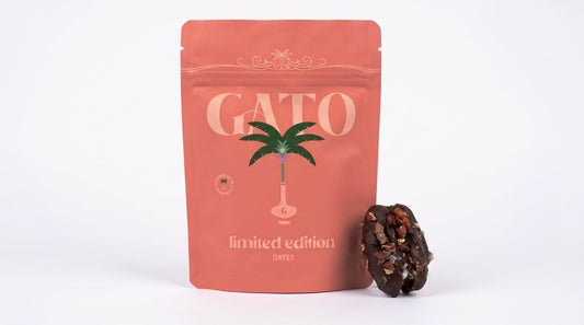 Gato limited-edition Pistachio Baklava chocolate-covered Medjool date beside the product pouch.